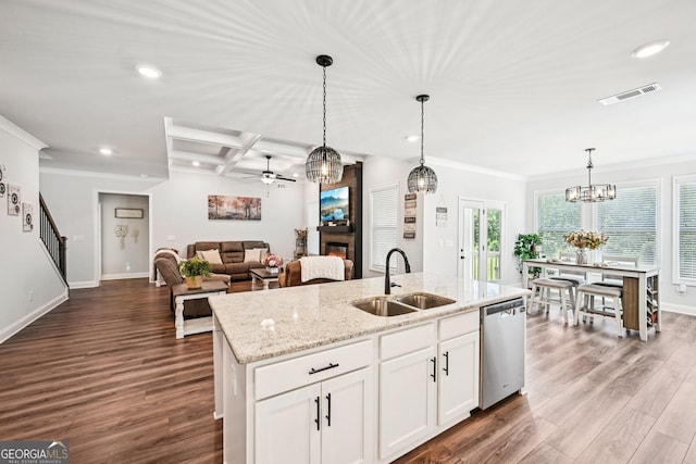4189 Brookmont Way, Auburn, GA 30011 - kitchen featuring stainless steel dishwasher, a glass covered fireplace, ceiling fan, recessed lighting, and dark wood-type flooring