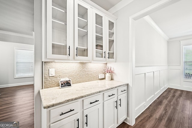 4189 Brookmont Way, Auburn, GA 30011 - bar area featuring dark wood finished floors, crown molding, wainscoting, and tasteful backsplash