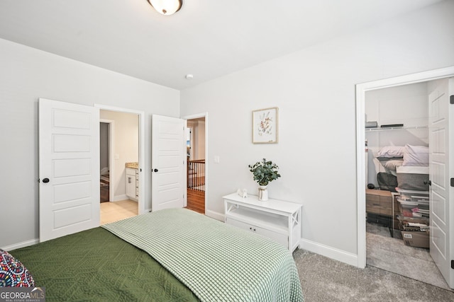 4189 Brookmont Way, Auburn, GA 30011 - bedroom with a walk in closet, light carpet, and a closet