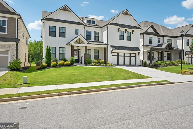 4189 Brookmont Way, Auburn, GA 30011 - multi unit property with a standing seam roof, concrete driveway, board and batten siding, and an attached garage
