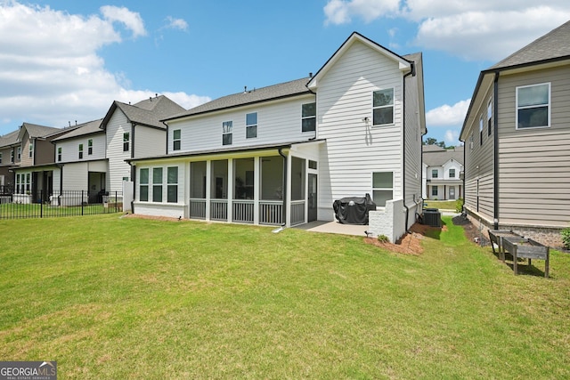 4189 Brookmont Way, Auburn, GA 30011 - rear view of house featuring a sunroom, a patio, and a residential view