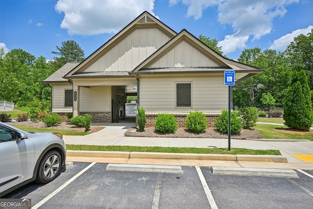 4189 Brookmont Way, Auburn, GA 30011 - craftsman-style home with board and batten siding, brick siding, and uncovered parking