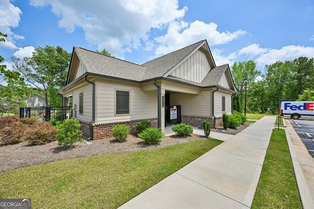 4189 Brookmont Way, Auburn, GA 30011 - view of home's exterior featuring board and batten siding, brick siding, and a shingled roof