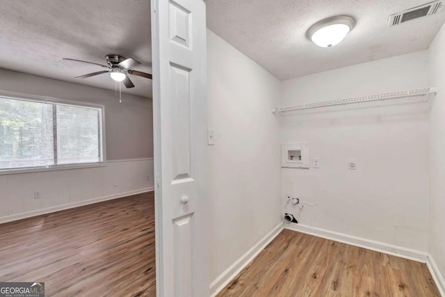 5215 Mainstreet Park Dr, Stone Mountain, GA 30088 - laundry area with washer hookup, hookup for a gas dryer, a textured ceiling, wood finished floors, and a ceiling fan