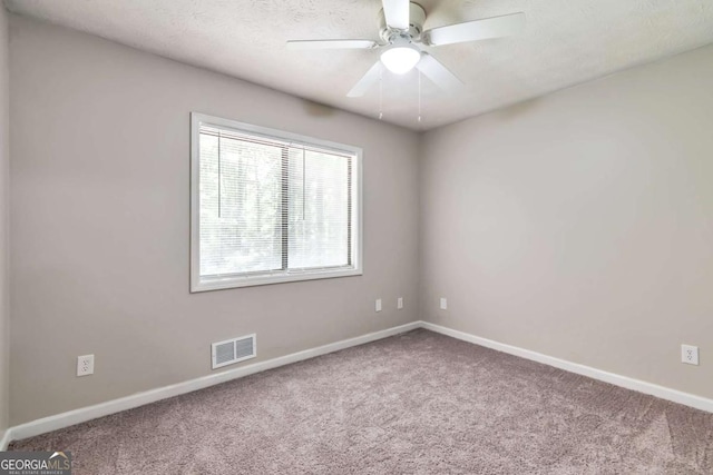 5215 Mainstreet Park Dr, Stone Mountain, GA 30088 - spare room with carpet flooring and a ceiling fan