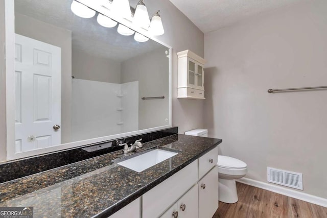 5215 Mainstreet Park Dr, Stone Mountain, GA 30088 - full bathroom featuring vanity, wood finished floors, and a shower