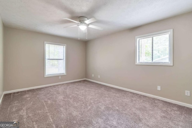 5215 Mainstreet Park Dr, Stone Mountain, GA 30088 - spare room featuring ceiling fan and carpet floors