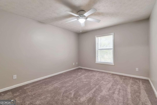 5215 Mainstreet Park Dr, Stone Mountain, GA 30088 - carpeted spare room with a ceiling fan and a textured ceiling