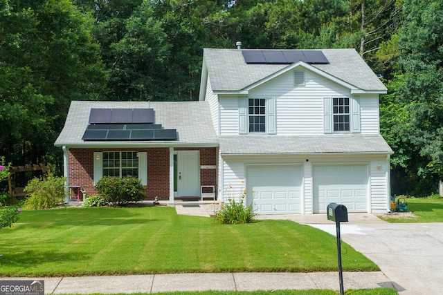 552 Caseys Xing, Winder, GA 30680 - view of front of house featuring solar panels, driveway, and a front lawn