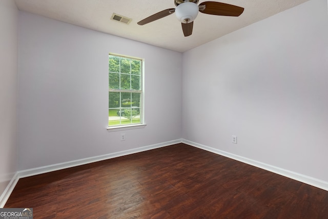 552 Caseys Xing, Winder, GA 30680 - spare room with dark wood finished floors and a ceiling fan