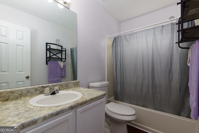 552 Caseys Xing, Winder, GA 30680 - bathroom featuring vanity, shower / bath combo with shower curtain, and a textured ceiling