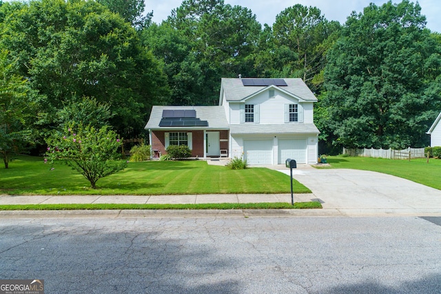 552 Caseys Xing, Winder, GA 30680 - view of front of house featuring driveway, roof mounted solar panels, and an attached garage