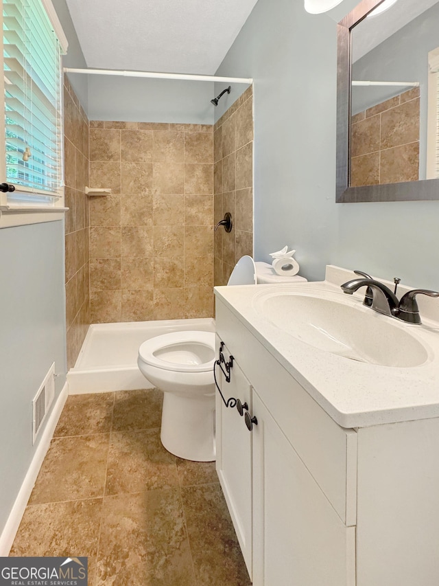 314 Pine St, Barnesville, GA 30204 - bathroom featuring vanity and tiled shower