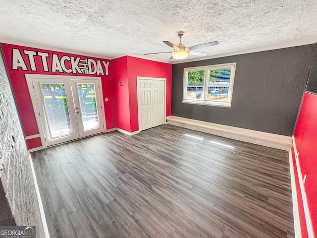 314 Pine St, Barnesville, GA 30204 - unfurnished bedroom with access to outside, french doors, wood finished floors, multiple windows, and a textured ceiling