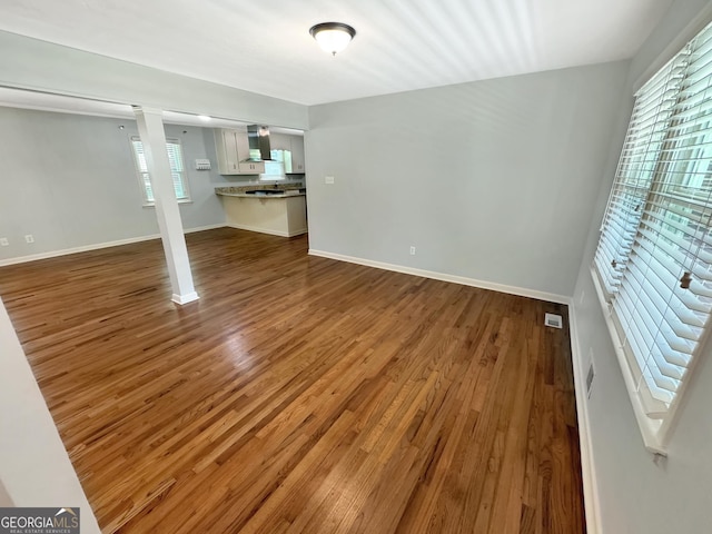 314 Pine St, Barnesville, GA 30204 - unfurnished living room with wood finished floors and baseboards