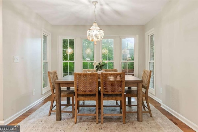 5114 N Ivy Rd NE, Atlanta, GA 30342 - dining area featuring a chandelier and wood finished floors