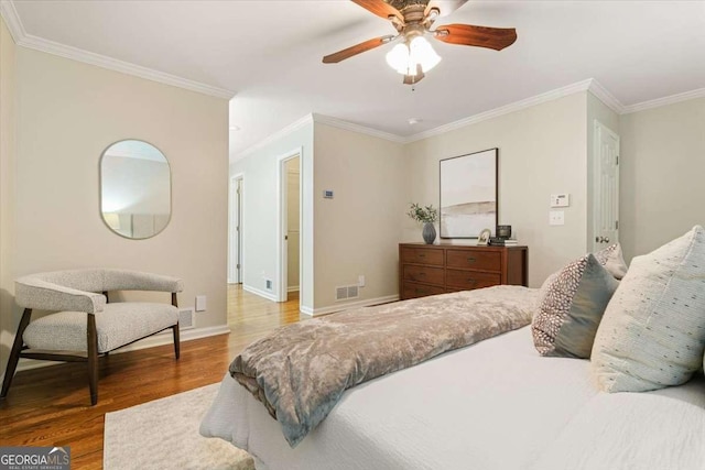 5114 N Ivy Rd NE, Atlanta, GA 30342 - bedroom with wood finished floors, crown molding, and a ceiling fan