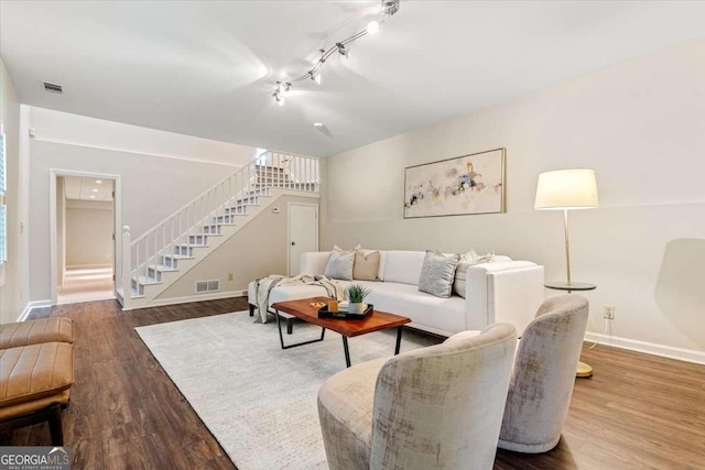 5114 N Ivy Rd NE, Atlanta, GA 30342 - living room with stairs, wood finished floors, and rail lighting