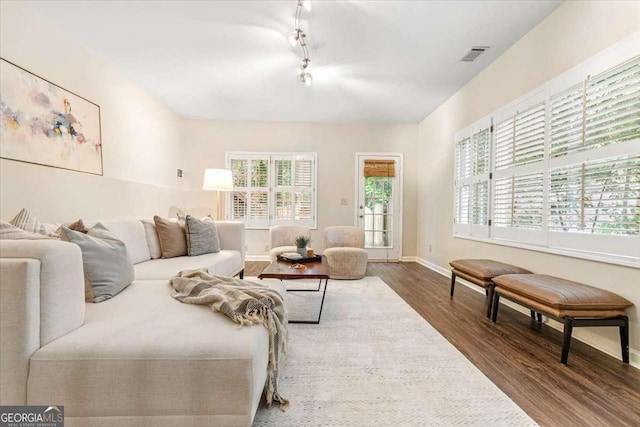 5114 N Ivy Rd NE, Atlanta, GA 30342 - living room with wood finished floors and rail lighting