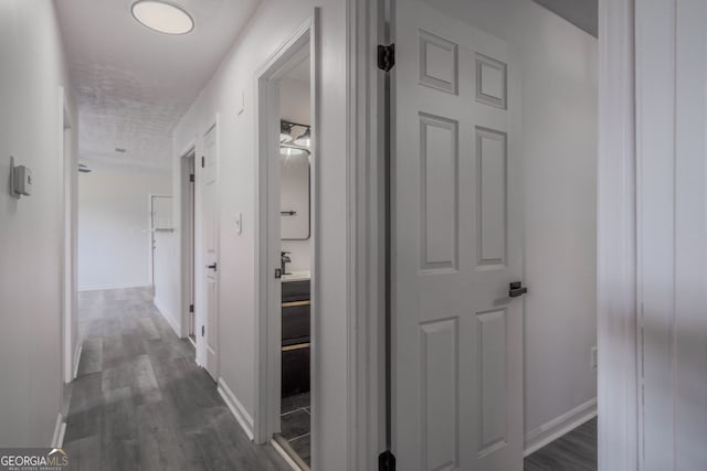 3570 Briar Dr, Lithia Springs, GA 30122 - corridor featuring dark wood-type flooring and baseboards