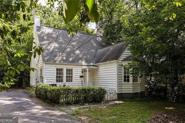 348 7th St NE, Atlanta, GA 30308 - view of front of house featuring a shingled roof and a chimney