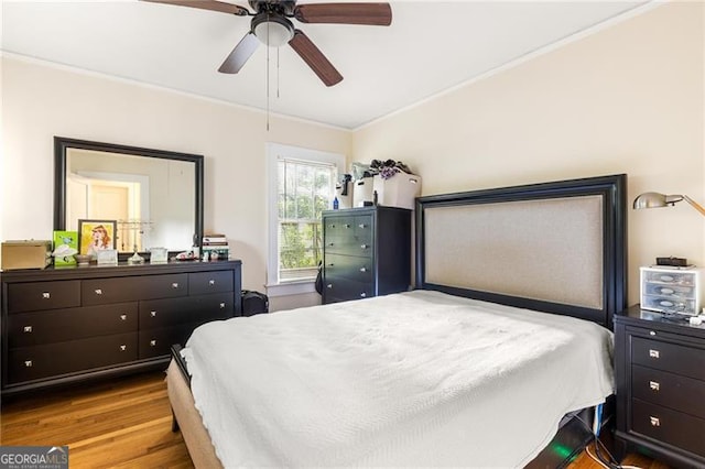 348 7th St NE, Atlanta, GA 30308 - bedroom with crown molding, wood finished floors, and ceiling fan