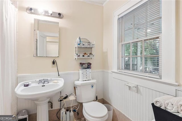 348 7th St NE, Atlanta, GA 30308 - bathroom with a wainscoted wall and ornamental molding