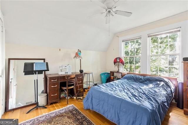 348 7th St NE, Atlanta, GA 30308 - bedroom featuring vaulted ceiling, light wood-type flooring, and a ceiling fan