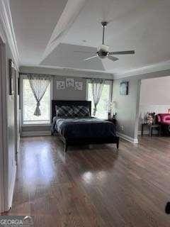 3560 Elinburg Dr, Buford, GA 30519 - bedroom featuring multiple windows, ornamental molding, wood finished floors, and ceiling fan