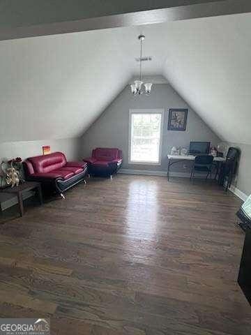 3560 Elinburg Dr, Buford, GA 30519 - bonus room featuring wood finished floors, vaulted ceiling, and a chandelier