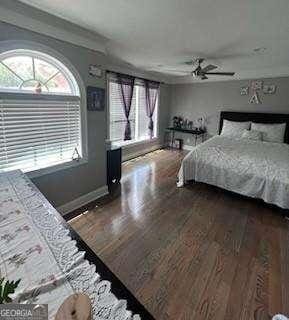 3560 Elinburg Dr, Buford, GA 30519 - bedroom with dark wood-style flooring and a ceiling fan