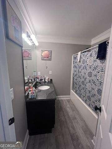 3560 Elinburg Dr, Buford, GA 30519 - full bathroom with ornamental molding, vanity, wood finished floors, and shower / tub combo
