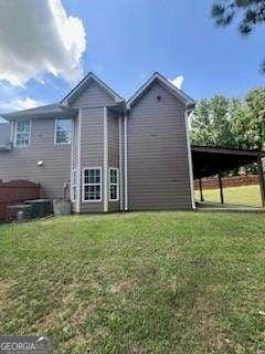 3560 Elinburg Dr, Buford, GA 30519 - rear view of property featuring a lawn