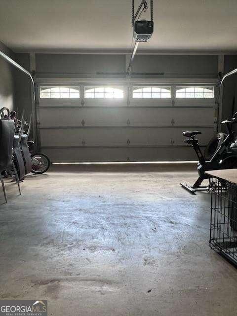 3560 Elinburg Dr, Buford, GA 30519 - garage featuring a garage door opener