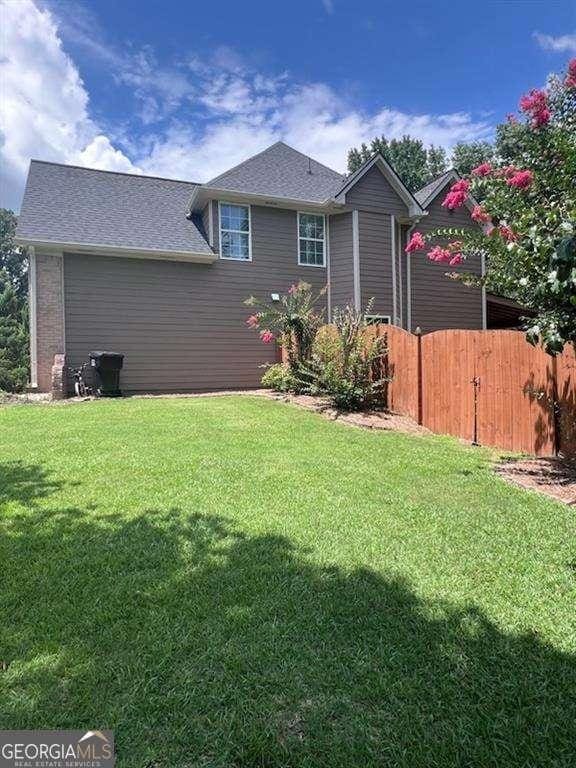 3560 Elinburg Dr, Buford, GA 30519 - rear view of house featuring a shingled roof