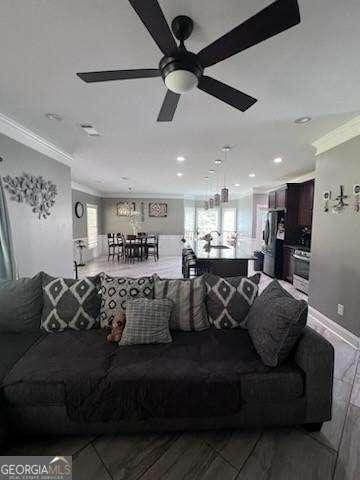 3560 Elinburg Dr, Buford, GA 30519 - living room with ornamental molding, plenty of natural light, wood finished floors, recessed lighting, and ceiling fan