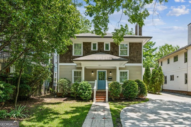 261 Elmira Pl NE, Atlanta, GA 30307 - view of front of property featuring covered porch and a chimney