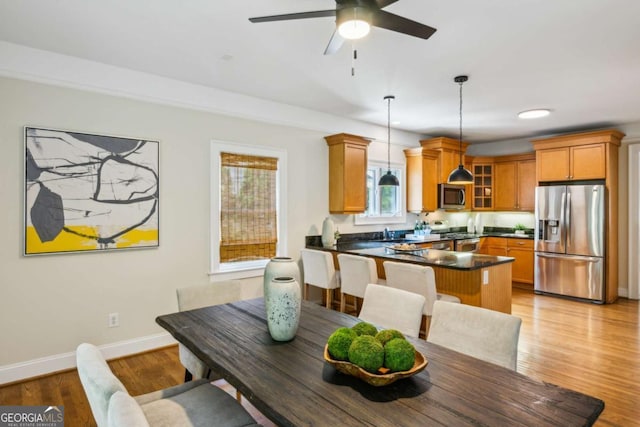 261 Elmira Pl NE, Atlanta, GA 30307 - dining room with a ceiling fan and light wood-style floors