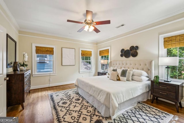 261 Elmira Pl NE, Atlanta, GA 30307 - bedroom with wood finished floors, ornamental molding, and a ceiling fan
