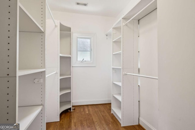 261 Elmira Pl NE, Atlanta, GA 30307 - walk in closet with wood finished floors