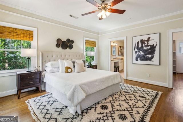 261 Elmira Pl NE, Atlanta, GA 30307 - bedroom featuring crown molding, wood finished floors, ensuite bathroom, and ceiling fan