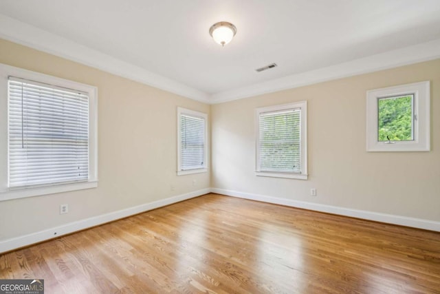 261 Elmira Pl NE, Atlanta, GA 30307 - empty room with healthy amount of natural light and wood finished floors