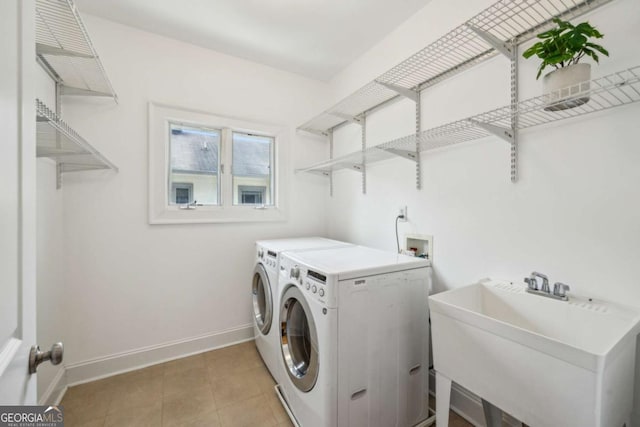 261 Elmira Pl NE, Atlanta, GA 30307 - laundry area featuring washer and clothes dryer and light tile patterned floors
