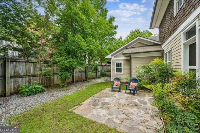 261 Elmira Pl NE, Atlanta, GA 30307 - fenced backyard featuring a patio