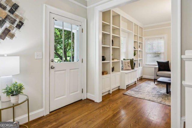 261 Elmira Pl NE, Atlanta, GA 30307 - entryway featuring plenty of natural light, wood finished floors, and crown molding