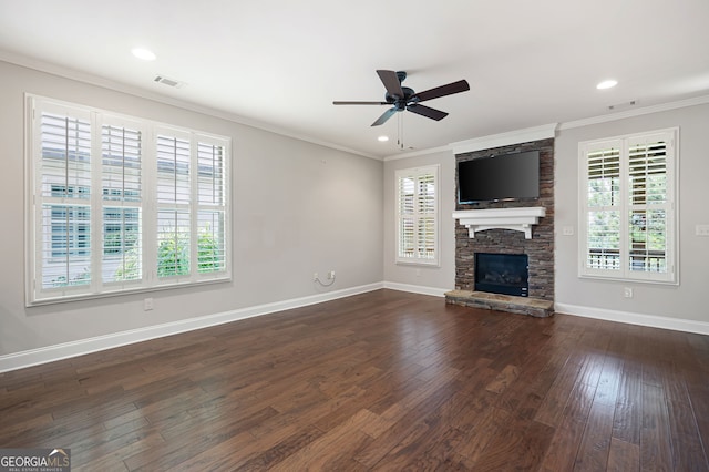 214 Misty View Dr, Canton, GA 30114 - unfurnished living room featuring healthy amount of natural light, ornamental molding, a fireplace, dark wood-type flooring, and a ceiling fan