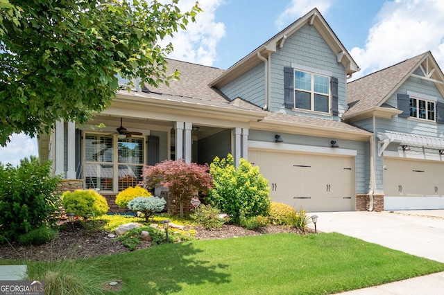 214 Misty View Dr, Canton, GA 30114 - craftsman-style home featuring a shingled roof, a garage, a ceiling fan, driveway, and a front lawn