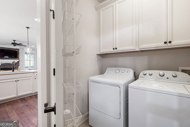 214 Misty View Dr, Canton, GA 30114 - laundry room with cabinet space, washing machine and dryer, a ceiling fan, and wood finished floors