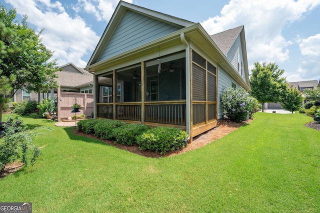 214 Misty View Dr, Canton, GA 30114 - view of home's exterior with a sunroom, ceiling fan, and a yard