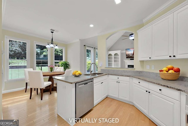 4206 Moccasin Trl, Woodstock, GA 30189 - kitchen with stainless steel dishwasher, ceiling fan, plenty of natural light, white cabinetry, and recessed lighting